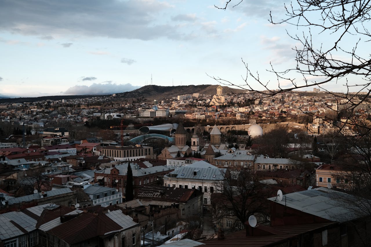 A panoramic view of Tbilisi showcasing historic architecture and vibrant urban life.