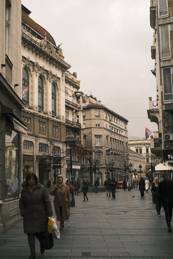 creative-03 Charming cityscape of Belgrade's traditional architecture with people strolling the streets.